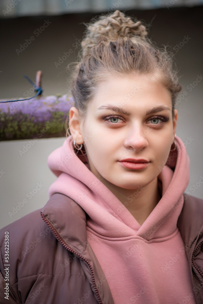 Portrait of a young beautiful blonde girl outdoors. There is artistic noise. Portrait of a young beautiful blonde girl outdoors. There is artistic noise.