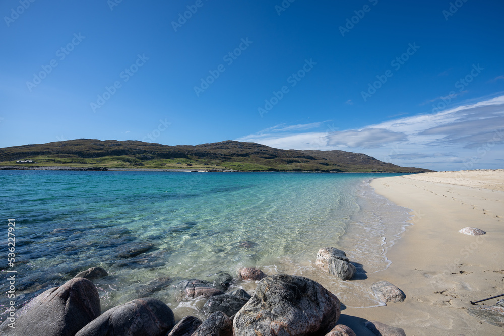 Clear water and golden sand at Hushinish beach on the Isle of Harris in Scotland on a sunny day