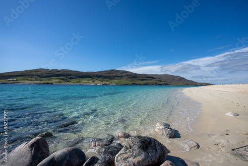 Clear water and golden sand at Hushinish beach on the Isle of Harris in Scotland on a sunny day