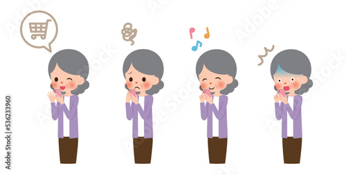 スマホを使用するシニア女性のイラスト素材