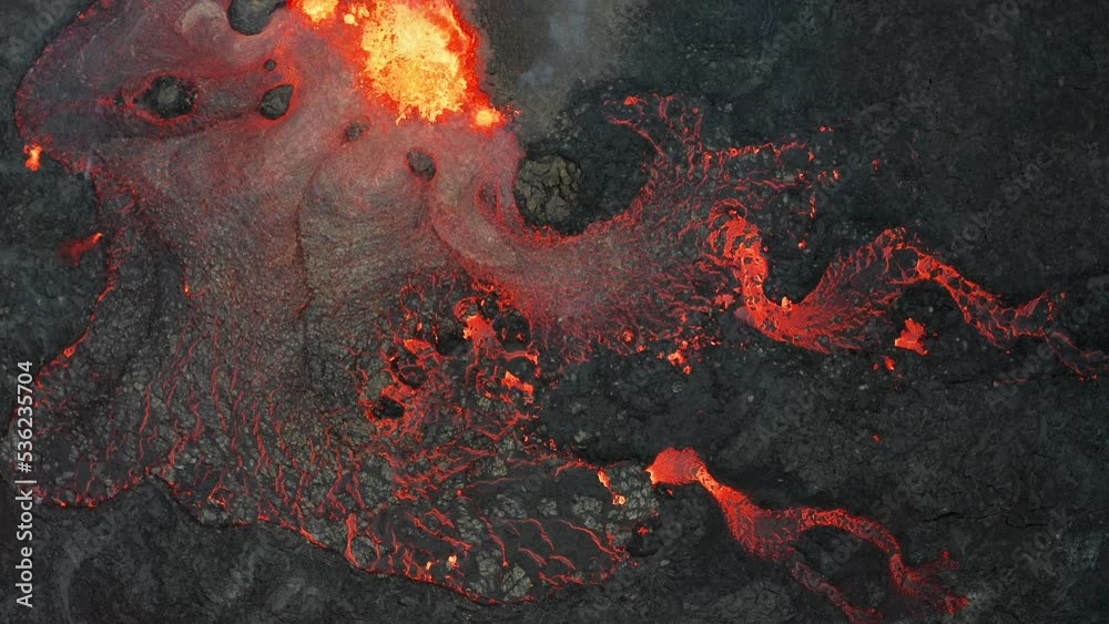 Active vulcano erupting lava and magma in Iceland, Fagradalsfjall 2022. Areal top down moving.