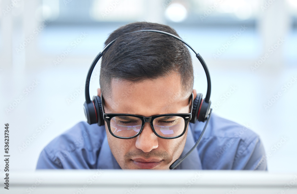 Call center worker in communication with people on internet online with computer at work, customer care help and contact us consulting at crm company. Man telemarketing employee working in an office Call center worker in communication with people on internet online with computer at work, customer care help and contact us consulting at crm company. Man telemarketing employee working in an office