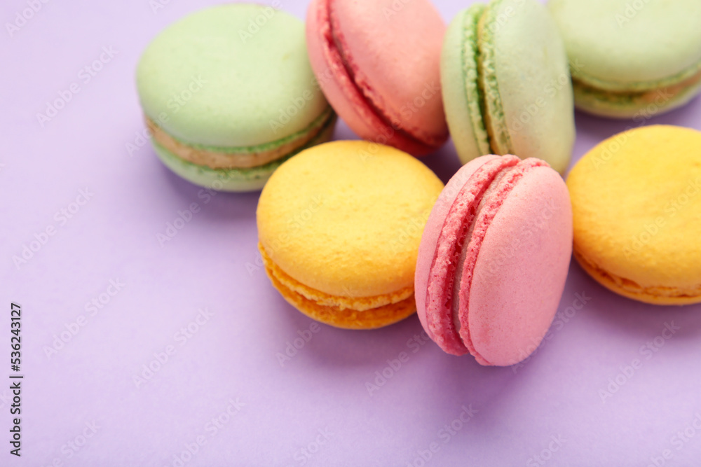French colorful macarons on purple background French colorful macarons on purple background