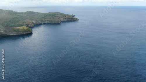 Iconic blue ocean and coastline of Inhabitat island, aerial view photo