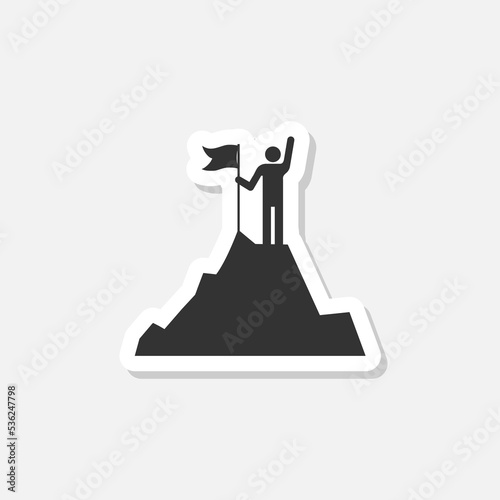 Businessman standing on the top of mountain holding a flag icon sticker isolated on white background