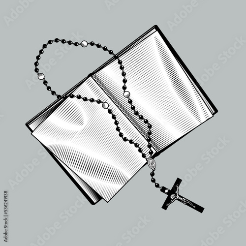 Engraved vintage drawing of old open book with prayer beads and cross