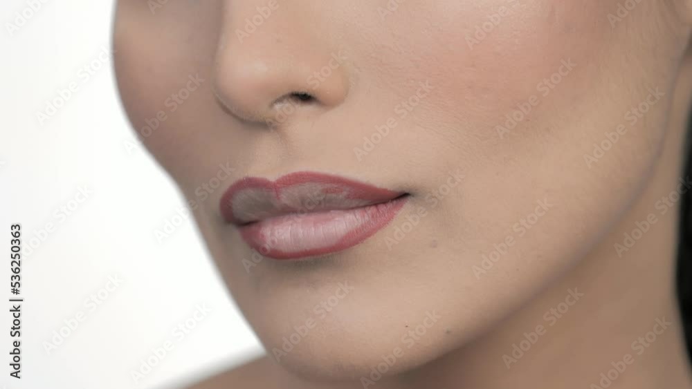 Fashion Model Wearing Cosmetic Makeup During Lipstick Application