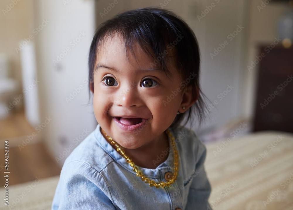 Baby, girl and cute with a down syndrome little child on a bed in the bedroom of her home alone. Children, kids and face with a sweet female kid looking innocent, pure and carefree in her house Baby, girl and cute with a down syndrome little child on a bed in the bedroom of her home alone. Children, kids and face with a sweet female kid looking innocent, pure and carefree in her house