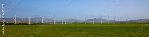 field of wind turbine panorama view in countryside photo