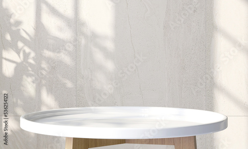 Fotografie Modern white glossy round wooden side table with sunlight and monstera leaf shad