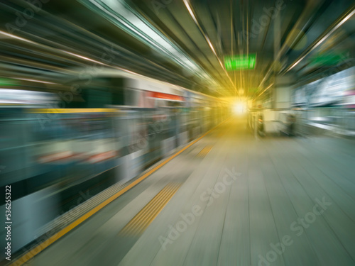 Blurred and moving images, perspective. Electric train or monorail. have few passengers Wait at the platform. Modern transportation systems during rush hour, fast travel, urban travel. © sutthichai