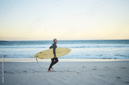 Canvas Print Beach, water and surf of a man on sand with surfboard walking the ocean coast in the morning outdoors