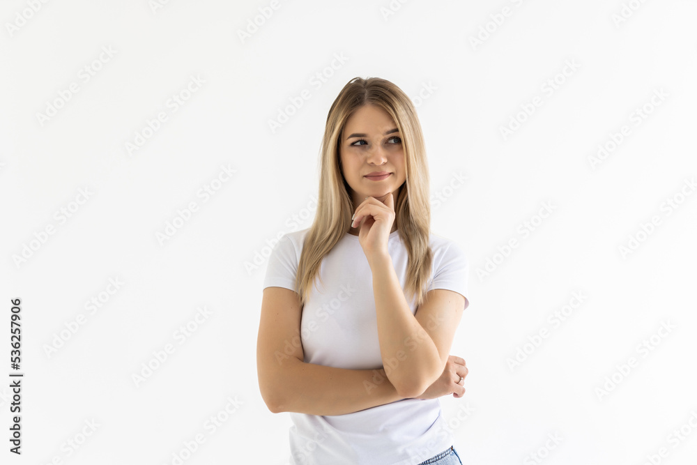 Portrait of a pretty smiling woman hands on chin posing isolated on a white background Portrait of a pretty smiling woman hands on chin posing isolated on a white background