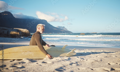Photography Surf, relax and senior man on the beach for sports, surfing and fun exercise for health, wellness and ocean sea freedom