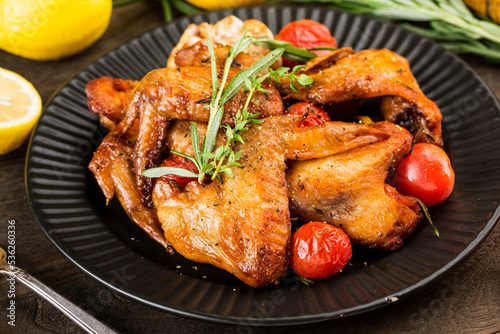 A plate of delicious roasted chicken wings