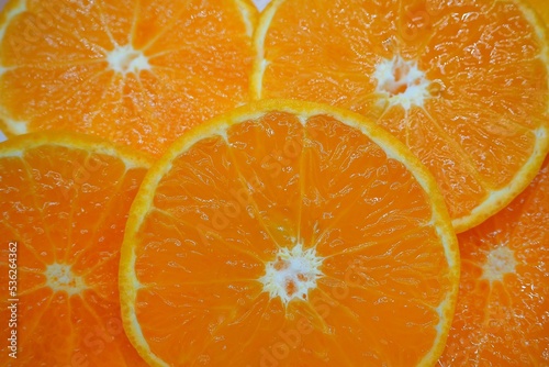 Slices round fresh orange texture background, concept mandarin, tangerine, wallpaper, vitamin c, natural, fruit, juice, vegetables 