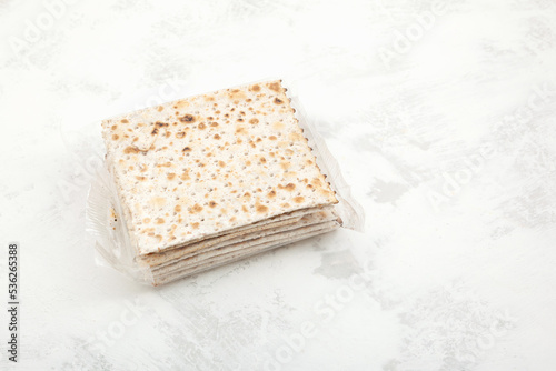 Matzah or Matzo kosher food for Passover, made from flour and water. Unleavened flatbread. Jewish cuisine photo