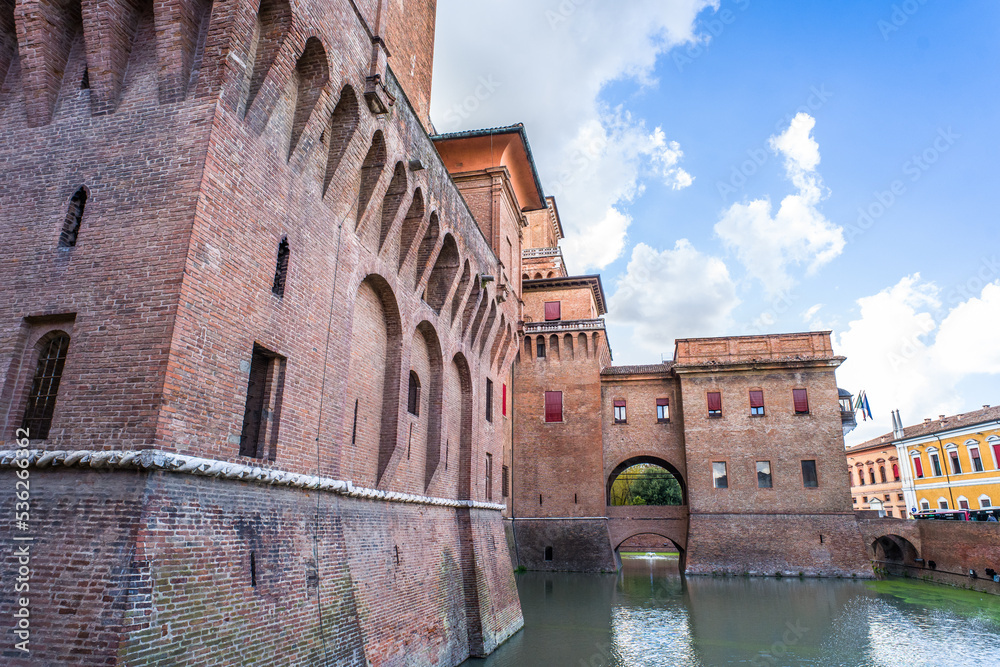wide-angle close-up of the brick building of the Castle d'Este in Ferrara