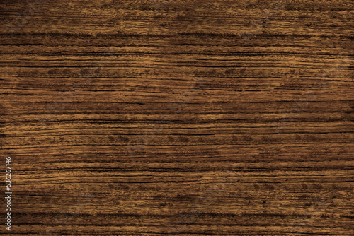 Heavily textured straight grain dark brown mozambique wood texture