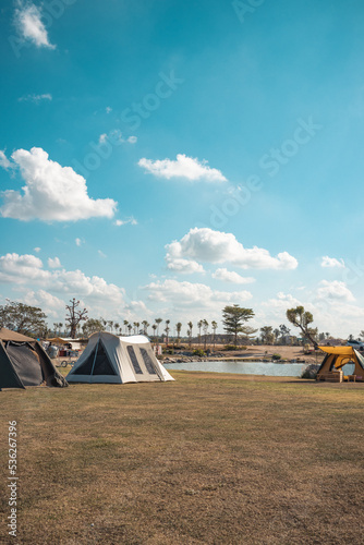 Wide shot of campsite with sky during daytime.