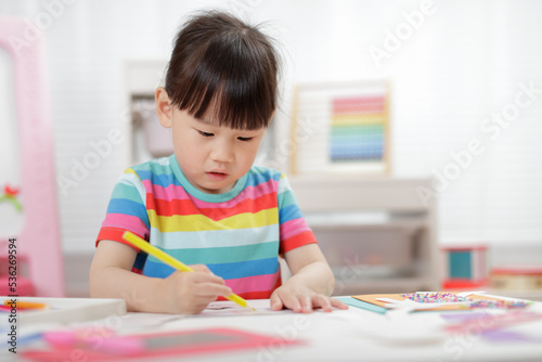  young girl making craft for homeschooling