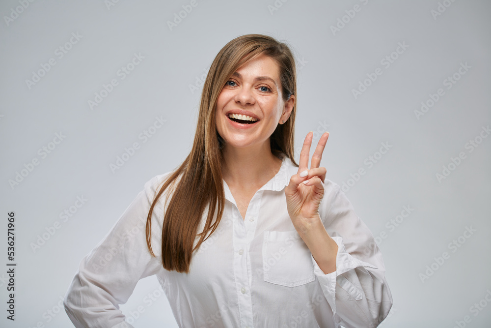 Portrait of smiling woman showing two fingers. Portrait of smiling woman showing two fingers.