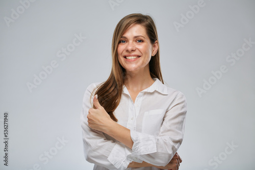 Portrait of smiling woman showing thumb up. Girl with big wide smile.