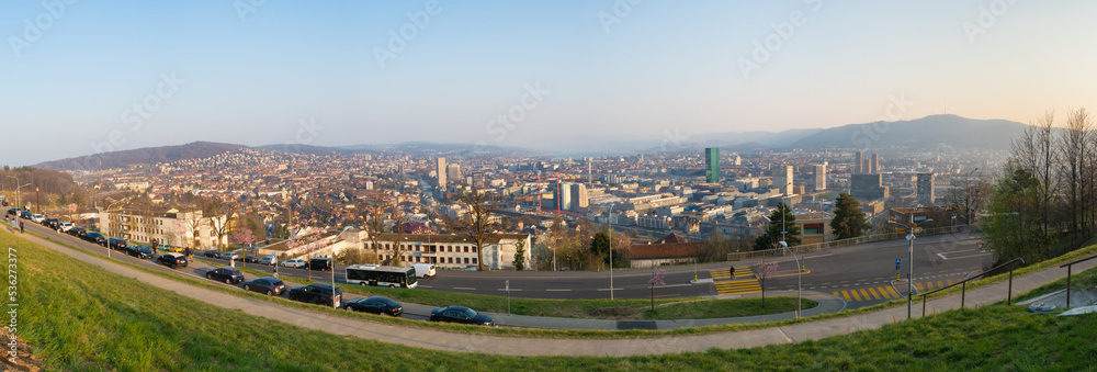 Fototapeta premium Zurich, Switzerland - March 26th 2022: Panoramic view over the city from the famous viewpoint Waid.