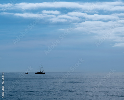 sailboat sailing on a calm sea