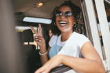 Woman, smile and road trip show peace in car, pickup or truck for vacation, holiday and relax. Girl, happy and smile in portrait in jeep, vehicle or van on travel on road, street or highway in Africa