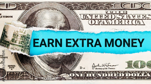 фотографія Earn extra money text written on with American Dollar-bills