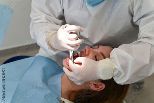 Concept of dentistry.A woman at a dentist's appointment to replace arches with braces.