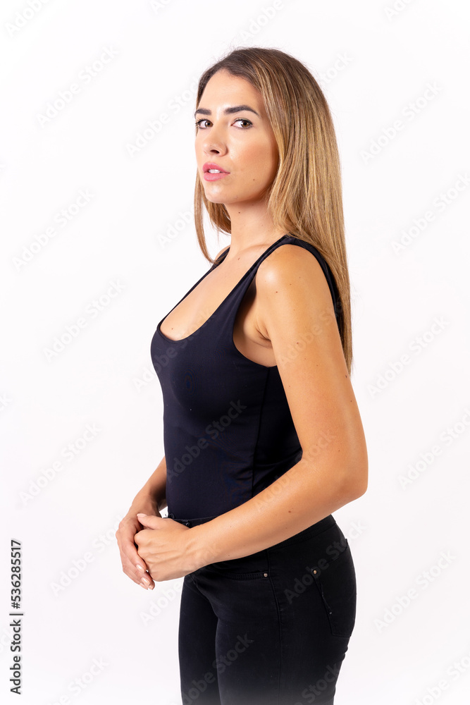 Blonde woman in a black tank top on a white background, American shot