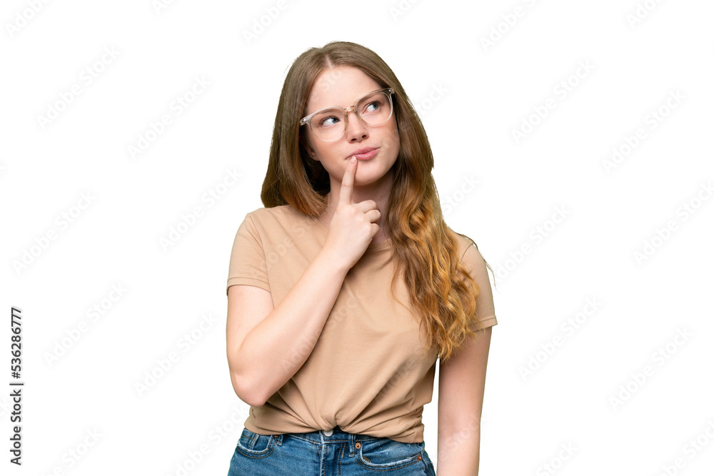 Young pretty woman over isolated background having doubts while looking up Young pretty woman over isolated background having doubts while looking up