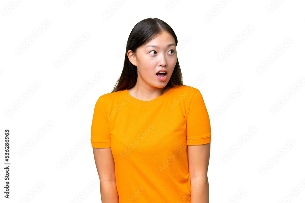 Young Asian woman over isolated background frustrated and covering ears Young Asian woman over isolated background frustrated and covering ears