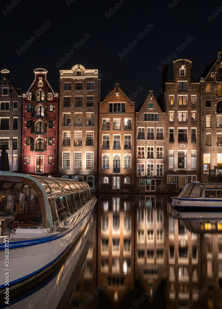 Dancing Houses Damrak Amsterdam during the night Netherlands Holland