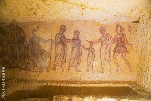 Ancestors painted in a tomb from etruscan necropolis of Tarquinia, Italy photo