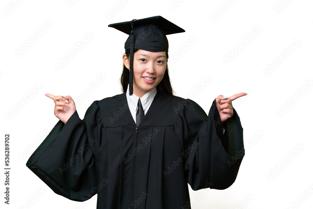 Young university graduate Asian woman over isolated background pointing finger to the laterals and happy Young university graduate Asian woman over isolated background pointing finger to the laterals and happy