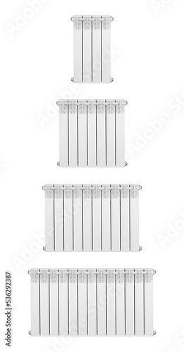Four sizes of radiators. Modern aluminum radiator for heating. Closeup. Isolated on a white background