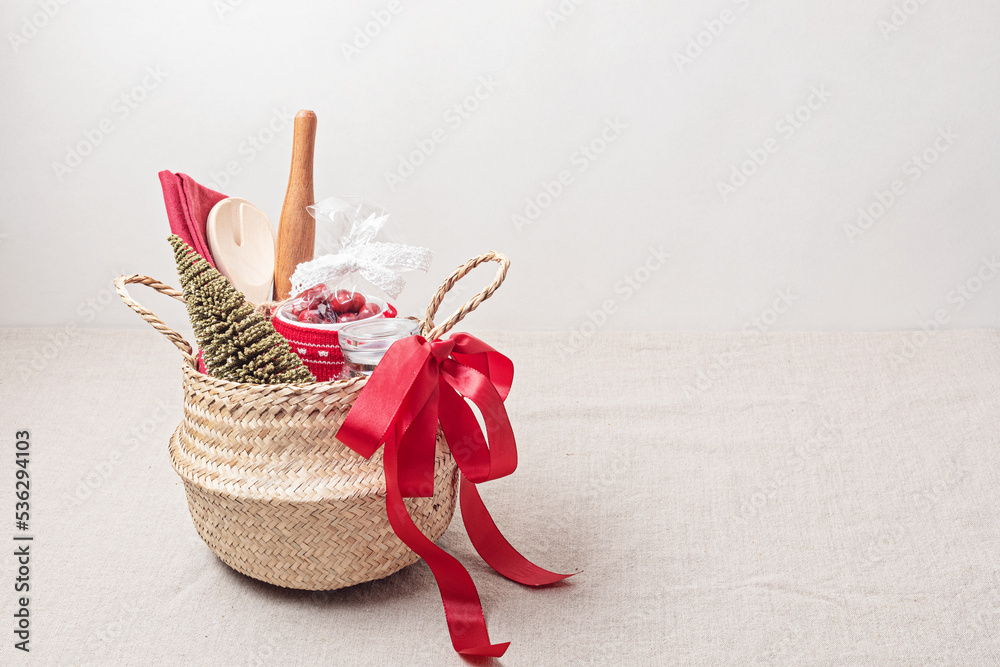 Refined Christmas gift basket for culinary enthusiats with mug, fruit tea and kitchen utensils. Corporate or personal present for cooking lovers, foodies and gourmands. Refined Christmas gift basket for culinary enthusiats with mug, fruit tea and kitchen utensils. Corporate or personal present for cooking lovers, foodies and gourmands.