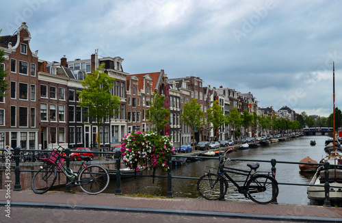 Bikes on a bridge over the canal in Amsterdam