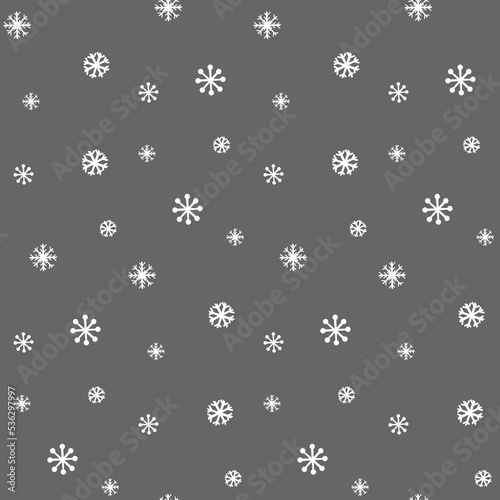 Seamless background with snowflakes on grey. Festive Christmas or New Year wrapping paper.