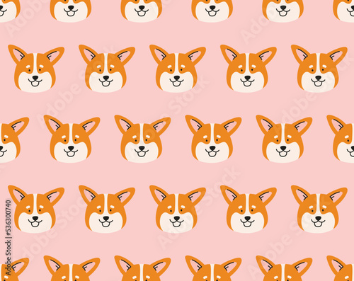 Seamless pattern of a welsh corgi dog head. Hand-drawn dog in a contemporary flat style. Cartoon animal, pet, purebred dog. Geometric pattern background.