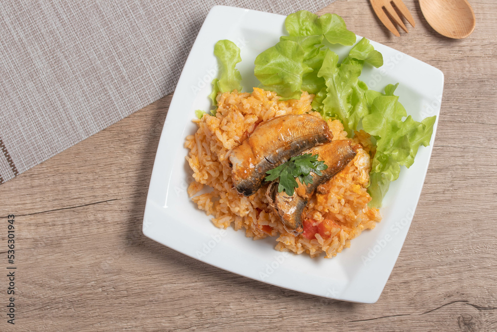 Fried rice with canned fish in a white plate.Thai food Fried rice with canned fish in a white plate.Thai food