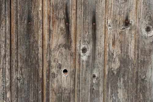 Wooden wall from old boards with knots and rusty nails, Wall panel, natural background vertical wood panel