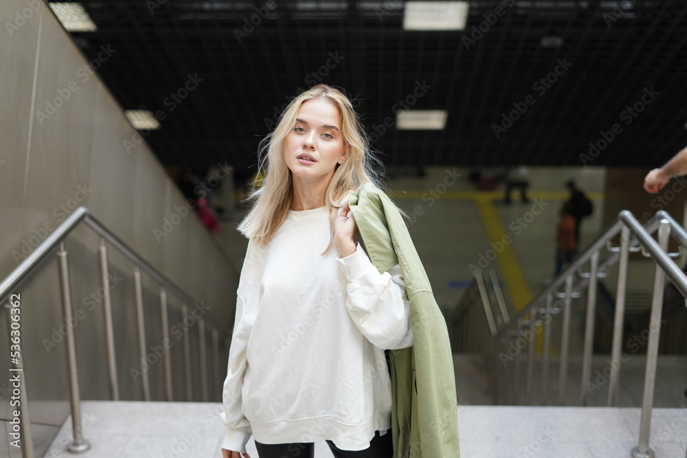 Fototapeta premium Beautiful Russian girl at the metro station