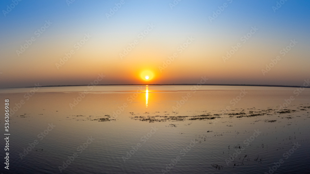Fototapeta premium sunset on the riverbank drone