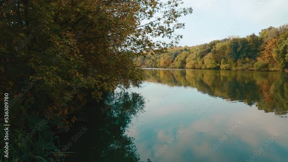Autumn Nature on the shores of the Southern Bug. The calm flow of the river. Reflection in the water of the sky and trees. Ukrainian nature. Beautiful nature on the shores of the Southern Bug. Autumn Nature on the shores of the Southern Bug. The calm flow of the river. Reflection in the water of the sky and trees. Ukrainian nature. Beautiful nature on the shores of the Southern Bug.
