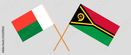 Crossed flags of Madagascar and Vanuatu. Official colors. Correct proportion