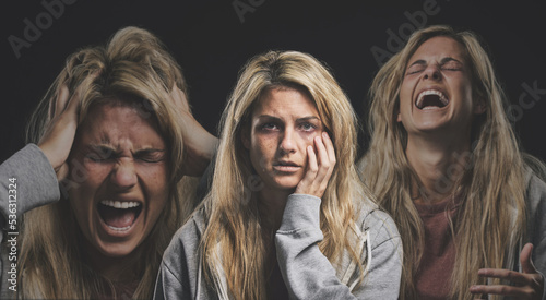 Portrait of a woman with depression, schizophrenia and mental health problem. Mockup for person with mental illness, bipolar disorder and anxiety. Angry, screaming and depressed crying girl in studio